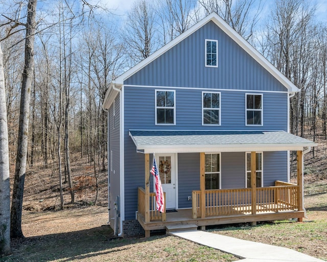 view of front of house featuring a porch, roof with shingles, and board and batten siding