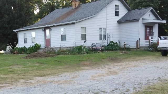 view of front of house with a chimney