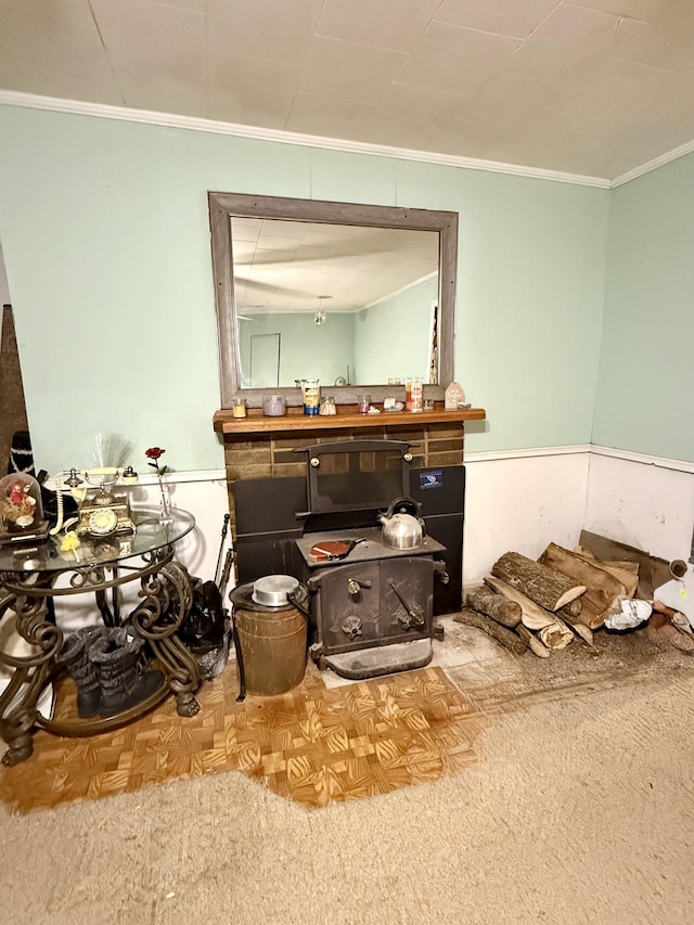 living area featuring crown molding