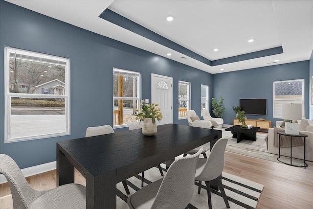 dining area with recessed lighting, a wealth of natural light, light wood finished floors, and baseboards