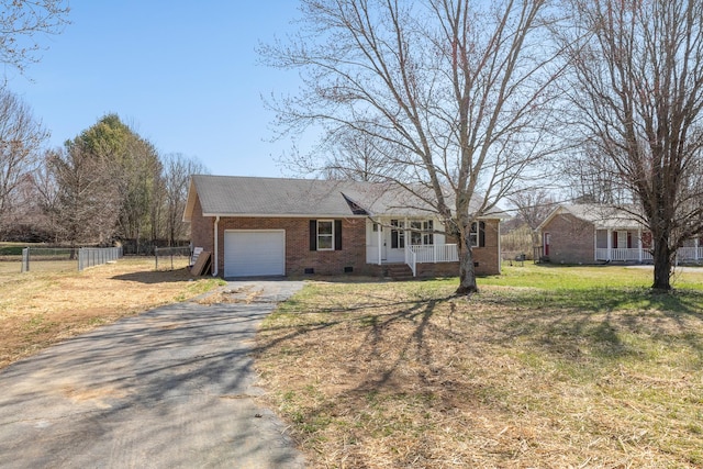 ranch-style house featuring fence, driveway, a porch, a garage, and crawl space