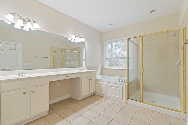 full bath featuring double vanity, tile patterned floors, a stall shower, a sink, and a bath