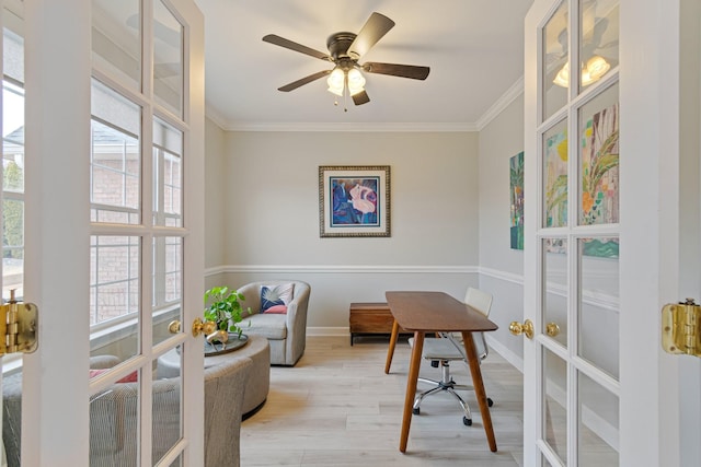 office area with baseboards, a ceiling fan, crown molding, french doors, and light wood-type flooring