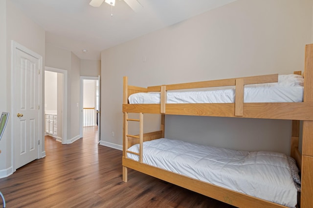 bedroom featuring ceiling fan, wood finished floors, and baseboards