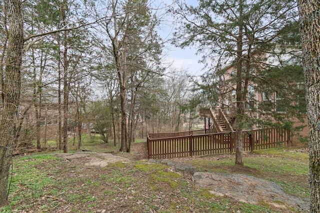 view of yard featuring stairs and fence