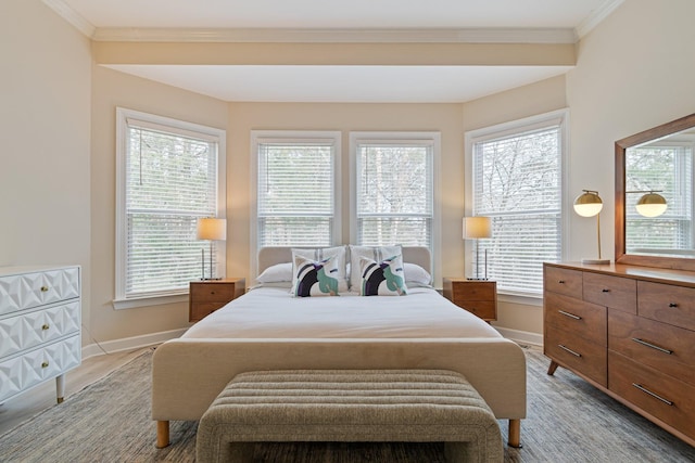 bedroom featuring multiple windows and crown molding