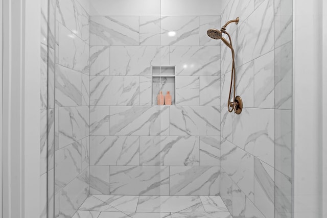 room details with a tile shower