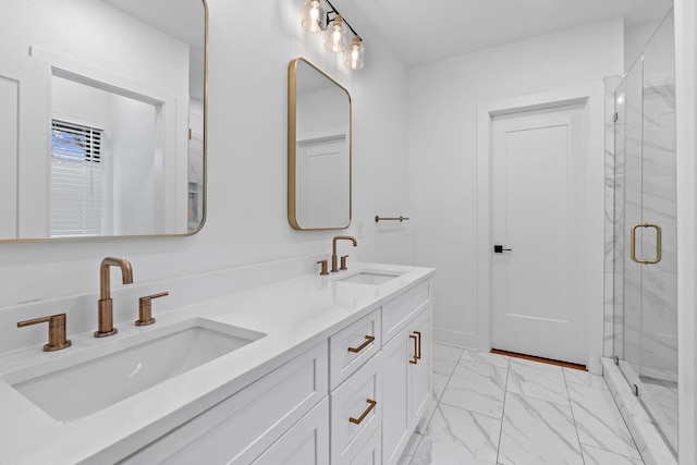 full bath with marble finish floor, double vanity, a stall shower, and a sink