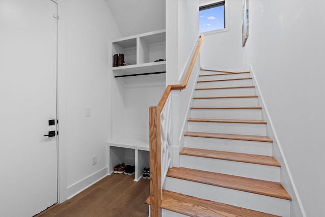 stairs with wood finished floors