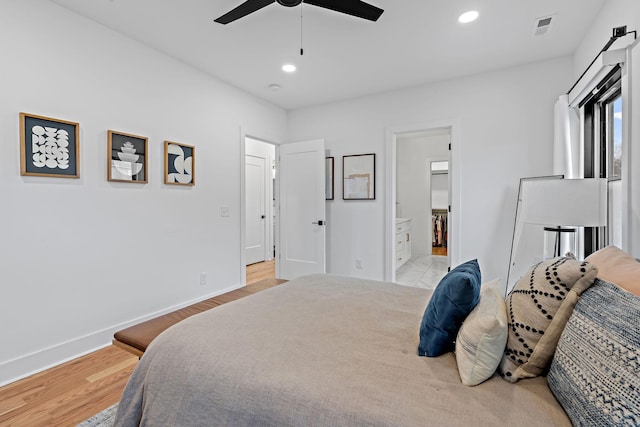 bedroom featuring baseboards, recessed lighting, visible vents, and light wood-style floors