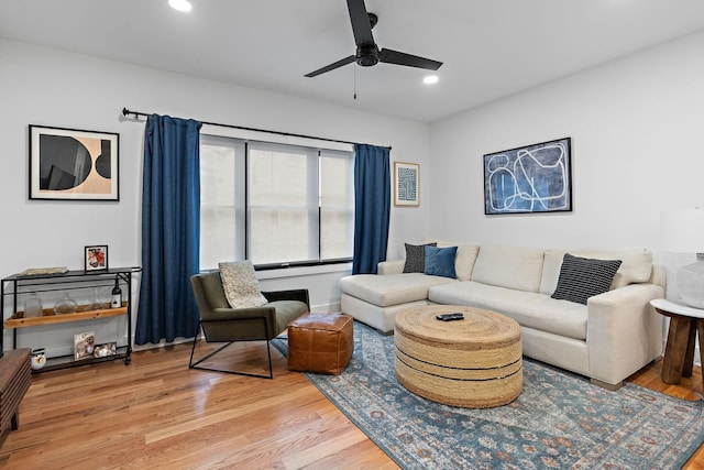 living room featuring ceiling fan, recessed lighting, and light wood-style floors