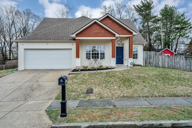 view of front of property with a shingled roof, an attached garage, a front yard, fence, and driveway