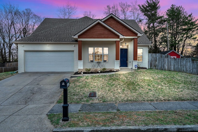 view of front of property with an attached garage, a shingled roof, brick siding, fence, and a front yard