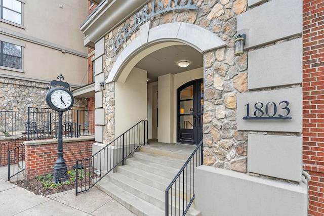 entrance to property featuring stone siding