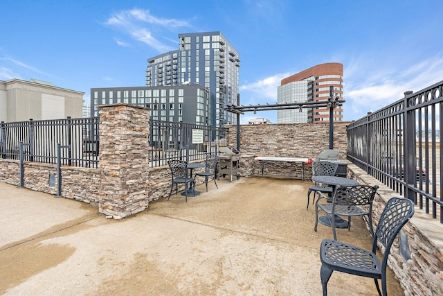 view of patio / terrace featuring fence