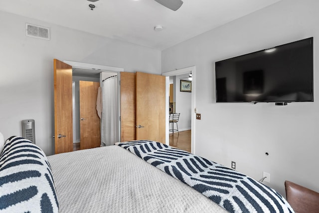 bedroom with ceiling fan and visible vents