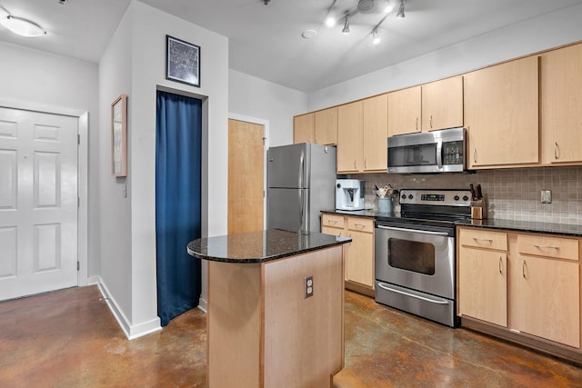 kitchen featuring light brown cabinets, appliances with stainless steel finishes, and concrete flooring