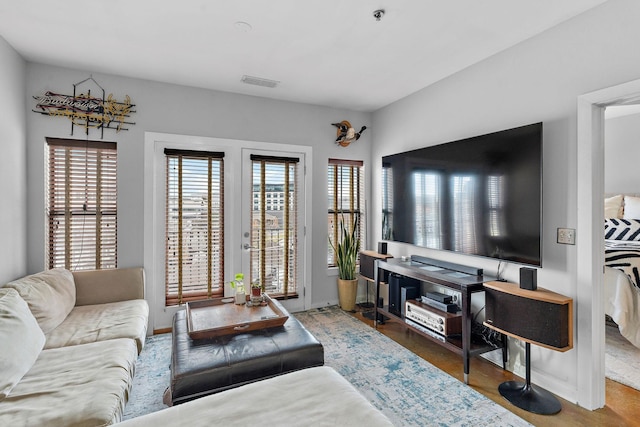 living area with french doors and visible vents