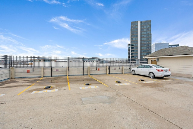 uncovered parking lot with fence