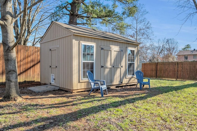 view of shed featuring a fenced backyard