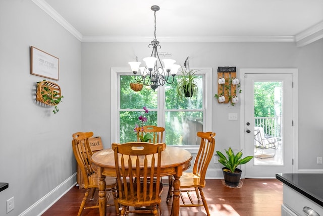 dining space with ornamental molding, dark wood-type flooring, and baseboards