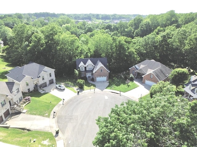 bird's eye view featuring a residential view and a forest view