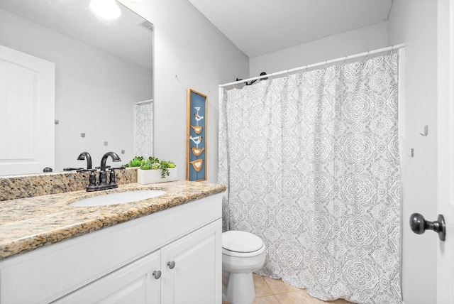 full bathroom featuring tile patterned flooring, a shower with curtain, vanity, and toilet