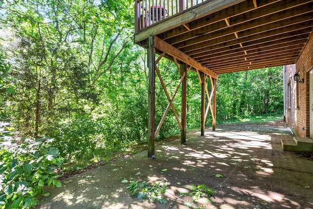 view of patio / terrace featuring a view of trees