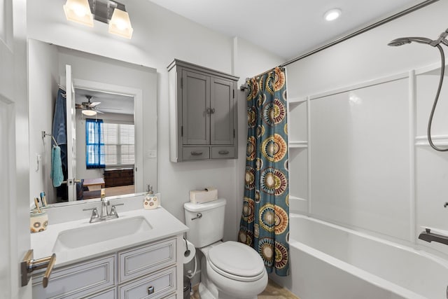 full bathroom with a ceiling fan, shower / tub combo, vanity, and toilet