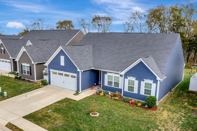 view of front of home featuring a garage, a shingled roof, a front lawn, and concrete driveway