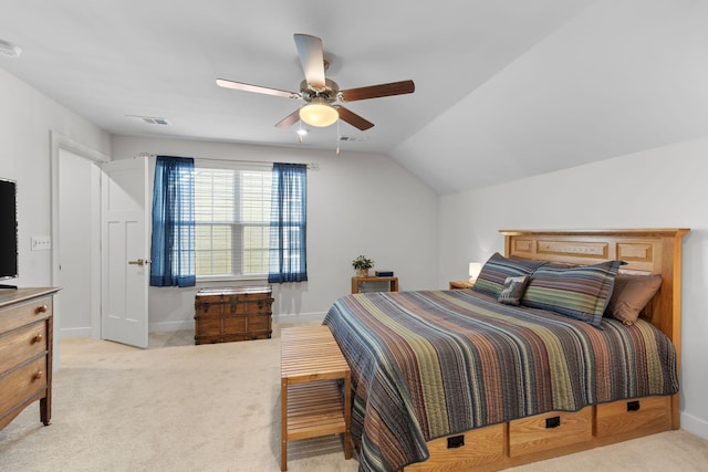 bedroom featuring lofted ceiling, light colored carpet, a ceiling fan, baseboards, and visible vents