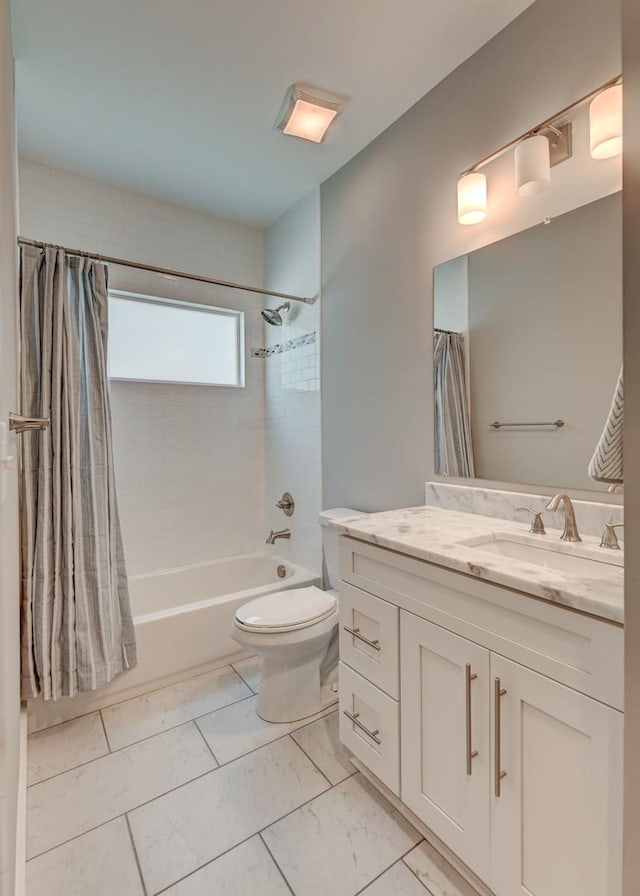 full bathroom with toilet, marble finish floor, shower / bath combo with shower curtain, and vanity