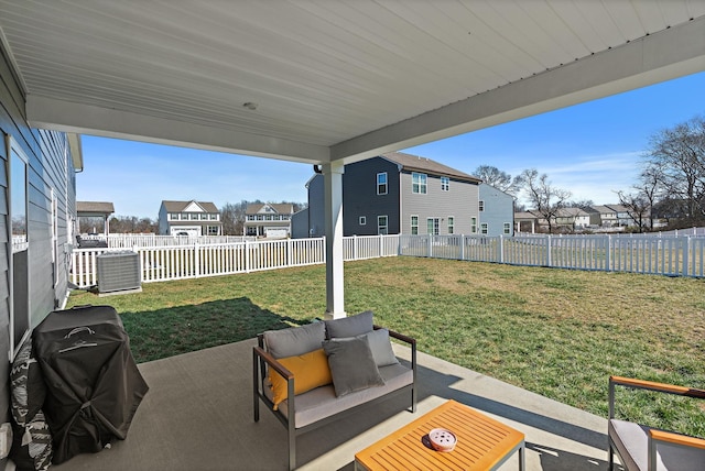 view of patio featuring a fenced backyard, cooling unit, outdoor lounge area, grilling area, and a residential view