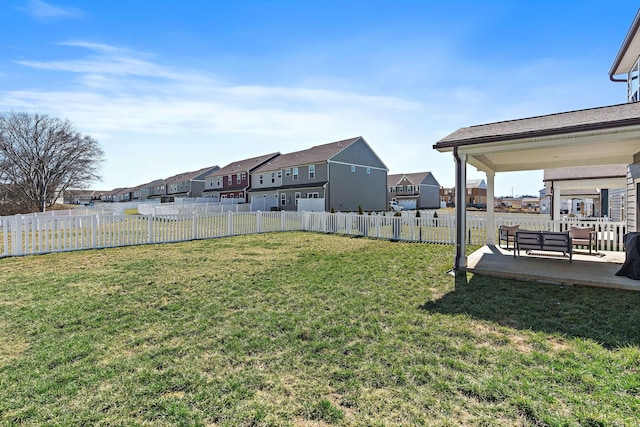 view of yard with a residential view, a patio area, and fence private yard