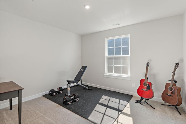 workout area with visible vents and baseboards