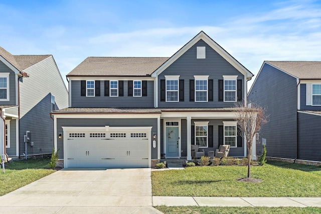 traditional home with a garage, a front yard, covered porch, and concrete driveway