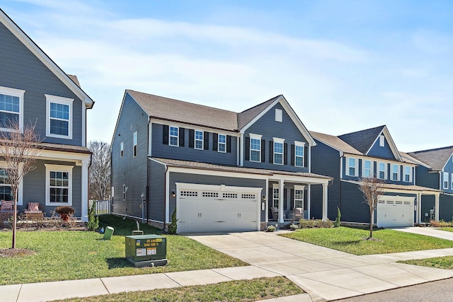 traditional home with a garage, a front yard, and driveway