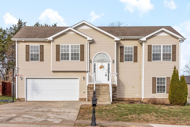 split foyer home with driveway and an attached garage