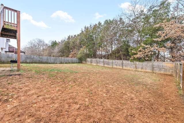 view of yard with a fenced backyard