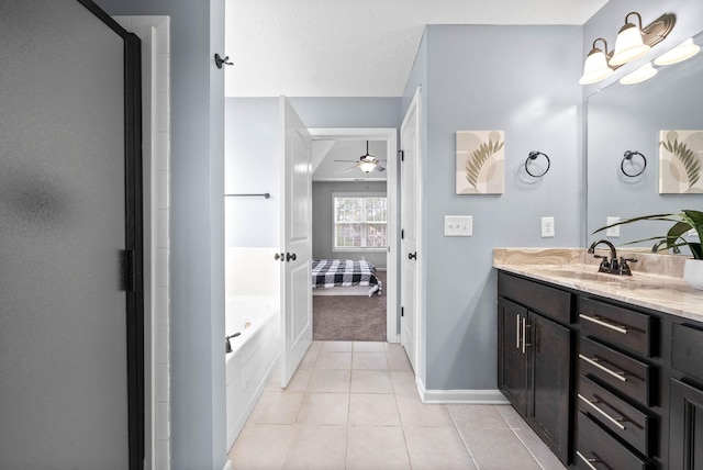 full bath with ceiling fan, vanity, ensuite bath, baseboards, and tile patterned floors