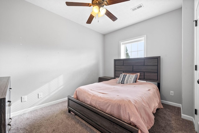 carpeted bedroom featuring baseboards, visible vents, and ceiling fan