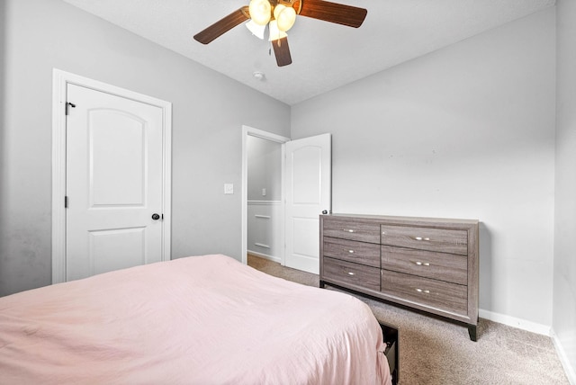 bedroom featuring carpet, ceiling fan, and baseboards