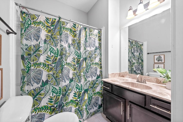 bathroom featuring toilet, tile patterned flooring, a shower with shower curtain, and vanity