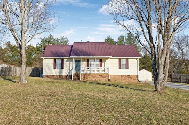 ranch-style house featuring metal roof, crawl space, fence, a porch, and a front yard