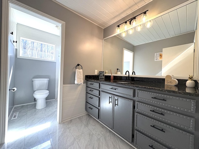 bathroom featuring marble finish floor, visible vents, toilet, vanity, and wooden ceiling