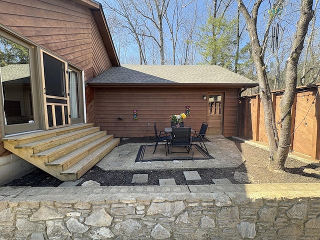 view of patio / terrace featuring entry steps and fence