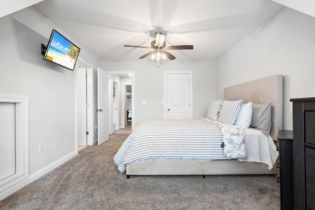 carpeted bedroom featuring a ceiling fan and baseboards