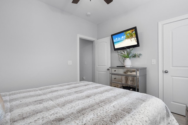 bedroom with ceiling fan and wood finished floors