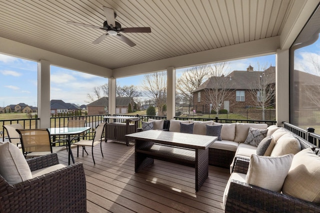 wooden deck featuring a ceiling fan, a residential view, fence, outdoor dining area, and an outdoor living space