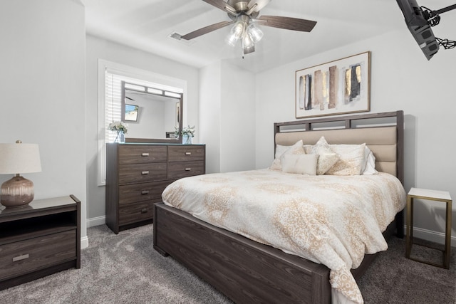 carpeted bedroom featuring a ceiling fan, visible vents, and baseboards